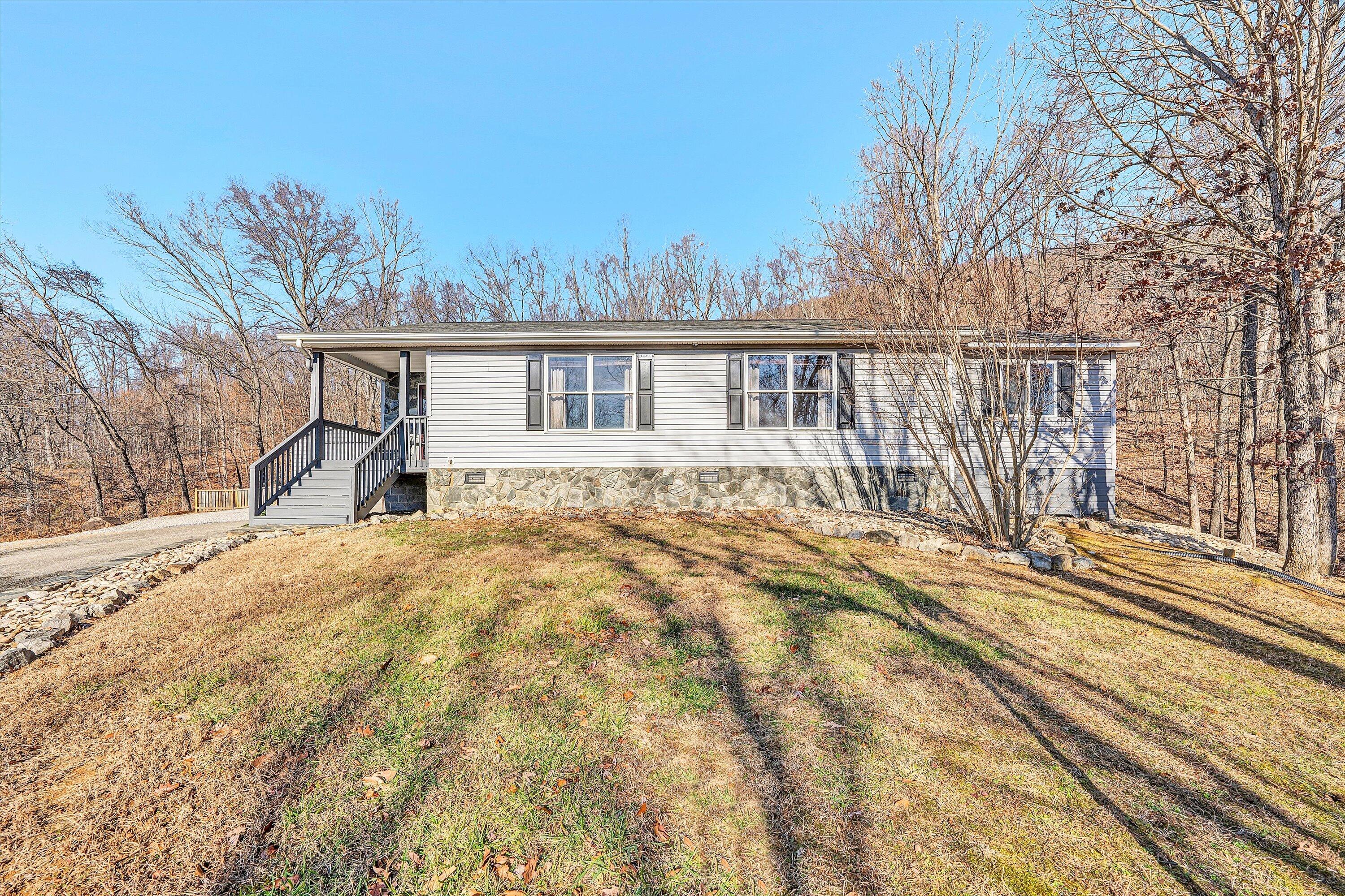 1311 Walnut Shell Drive Vinton, VA 24179 - Photo 45 of 61 a front view of a house with a yard and trees