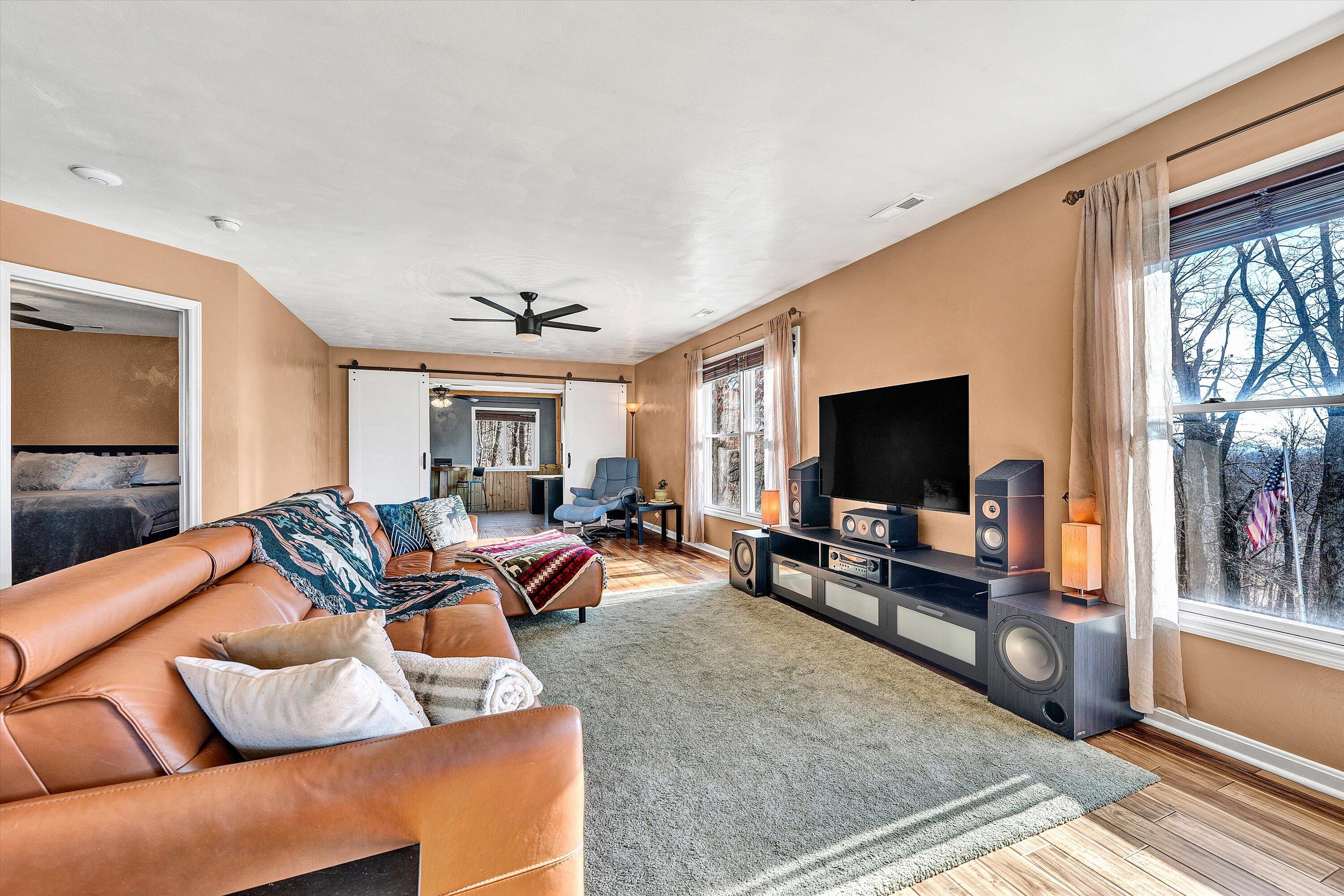 1311 Walnut Shell Drive Vinton, VA 24179 - Photo 7 of 61 a living room with furniture and a flat screen tv