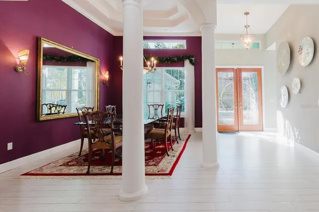 a bedroom with furniture and a large window