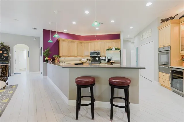 a bedroom with a bed and painting on the wall