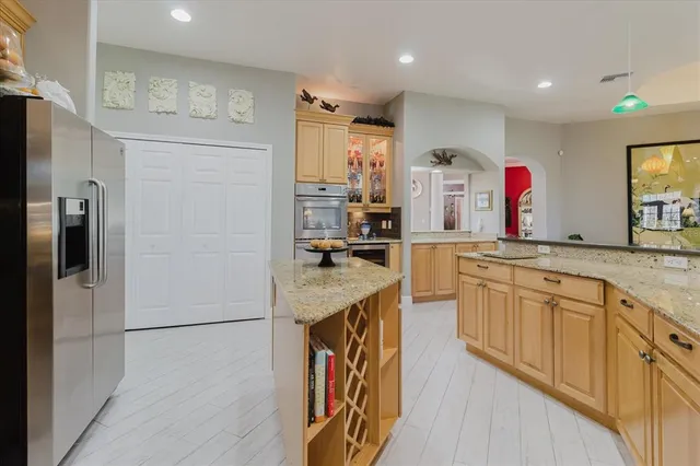 a view of a room with a ceiling fan and window