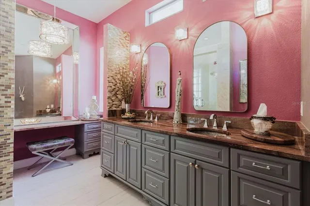 a living room with furniture fireplace and a large window