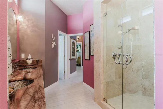 a view of a yard with plants and a fountain