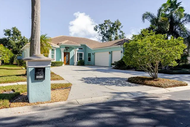 a view of a dining room with furniture a chandelier and wooden floor