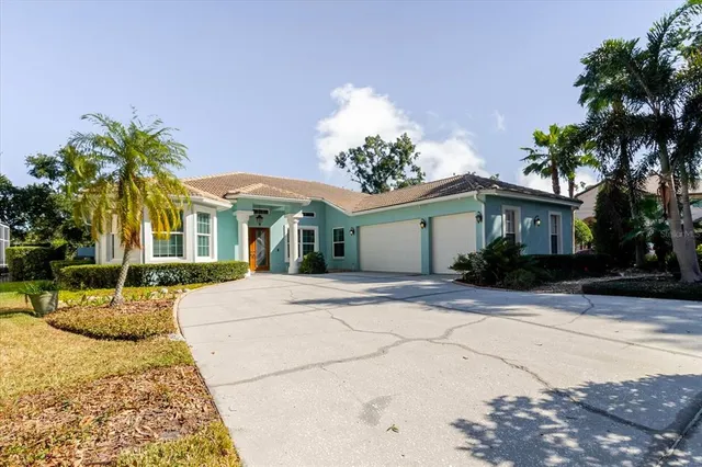 a view of a dining room with furniture and a chandelier