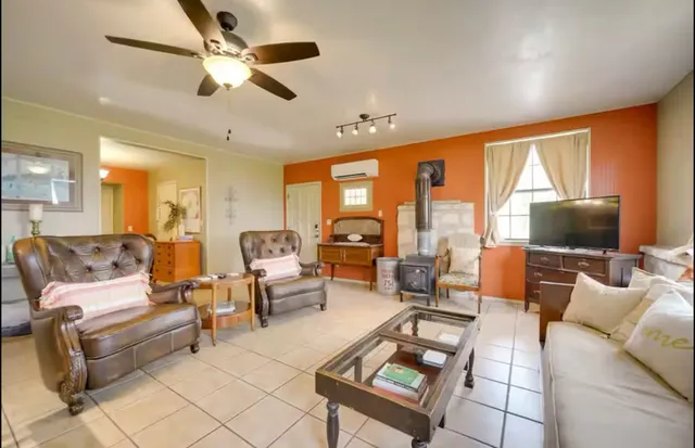 a bathroom with a toilet mirror and vanity