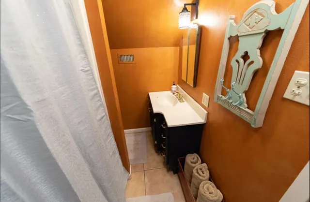 a bathroom with a sink and shower