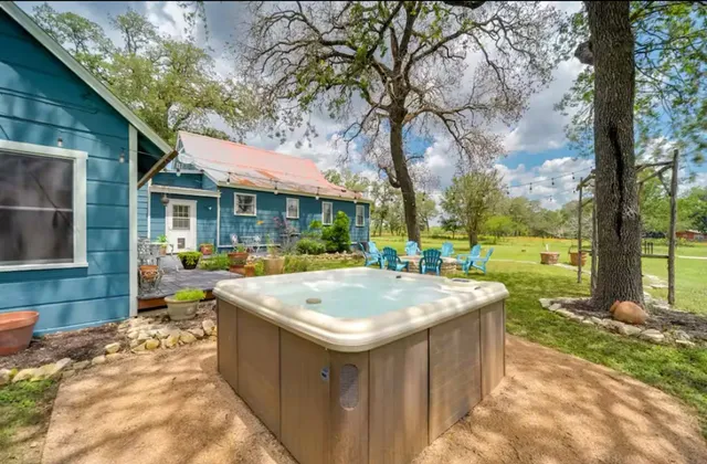 a front view of a house with yard and seating area