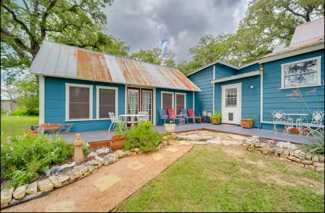 a view of yard with swimming pool and green space