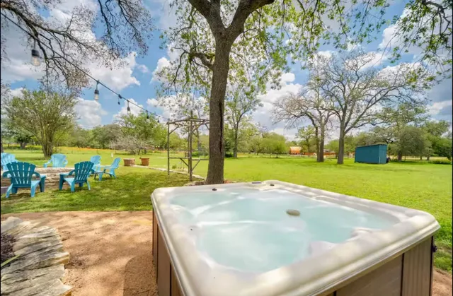 a view of a patio with table and chairs and potted plants