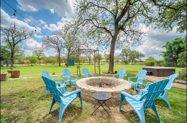 a view of yard with swimming pool and green space