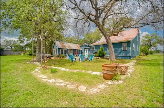 a front view of a house with yard