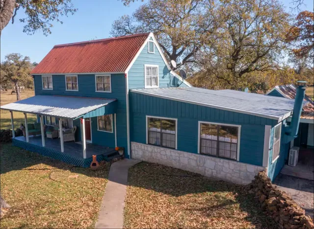 a living room with furniture a wooden floor and window with outer view