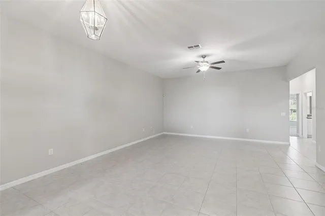 a kitchen with stainless steel appliances granite countertop a sink refrigerator and cabinets