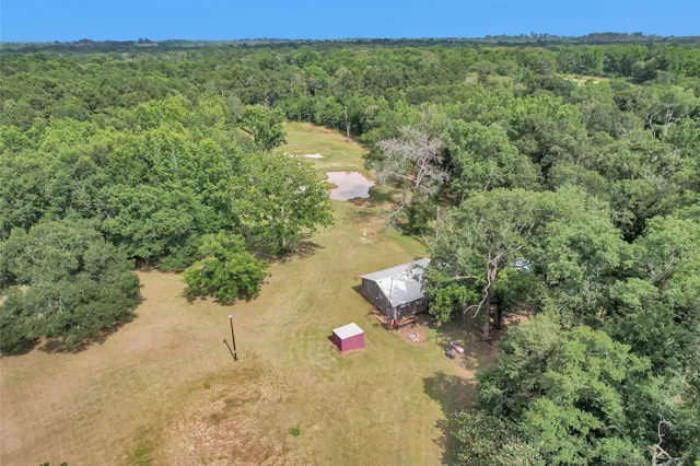 a view of a yard with furniture and a slide