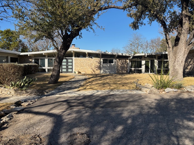3400 Stoneridge Road, Unit B Austin, TX 78746 - Photo 1 of 1 a view of a house with a yard