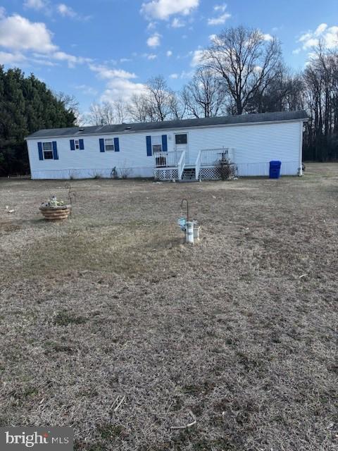 824 Todds Chapel Road Greenwood, DE 19950 - Photo 1 of 17 a view of a dry yard with wooden fence
