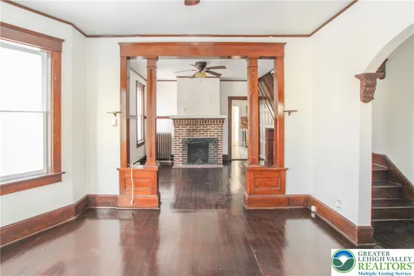 a view of an entryway with wooden floor