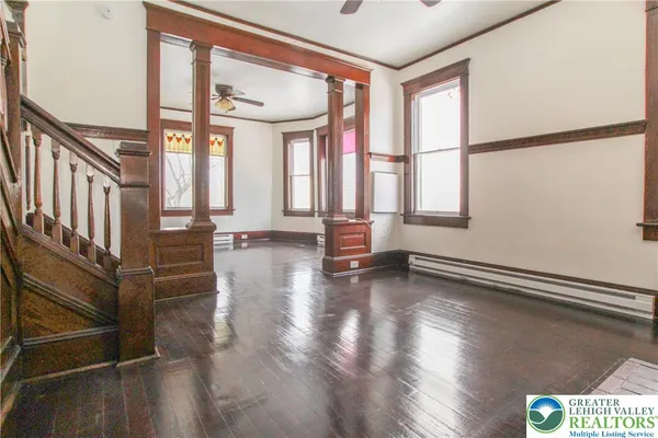 a view of an entryway with wooden floor