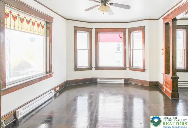 a view of an empty room with a window