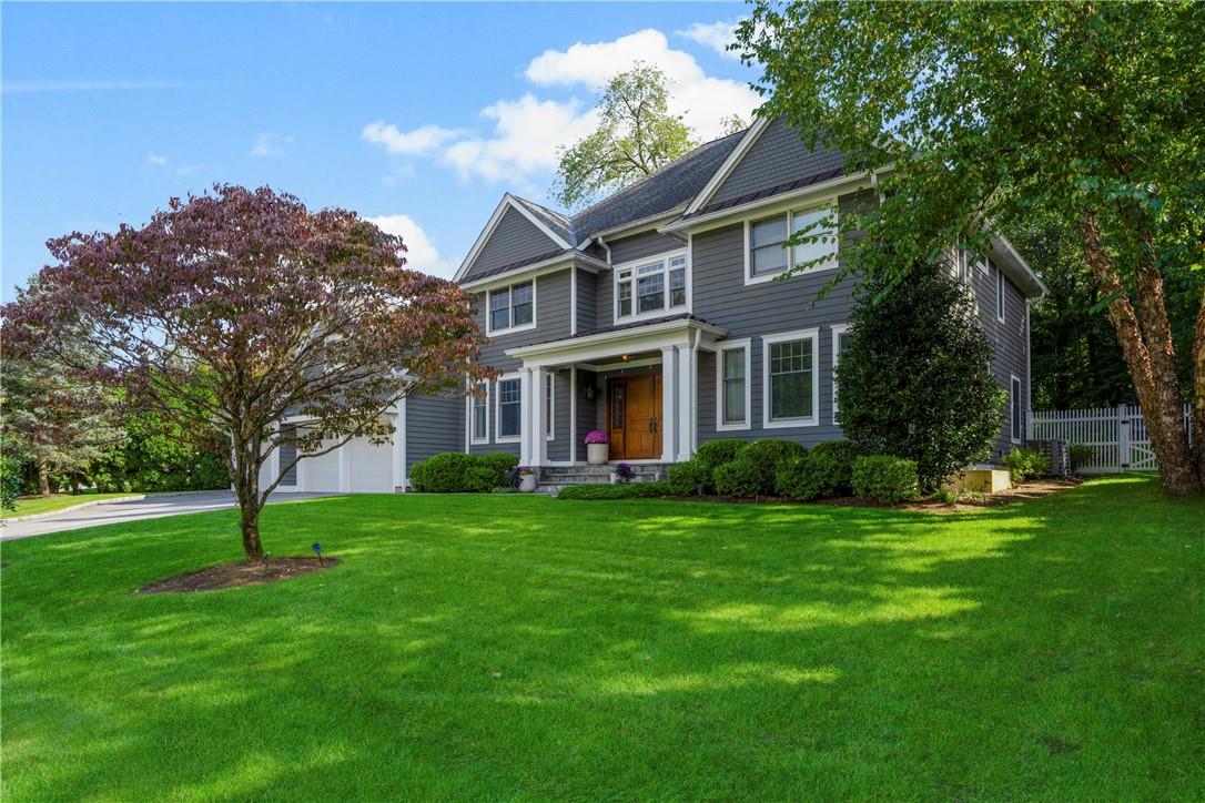 7 Hannan Place Rye, NY 10580 - Photo 1 of 1 a front view of a house with a garden