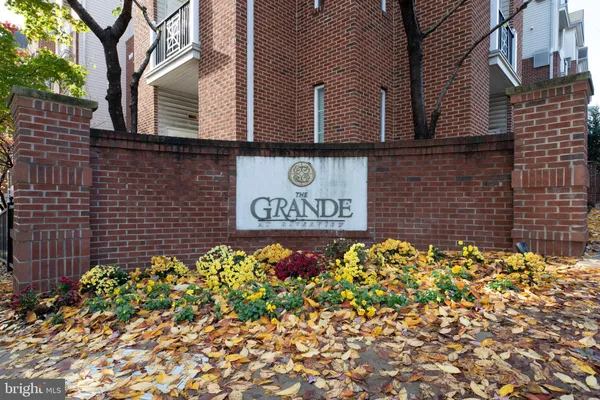 a sign broad in front of a brick building
