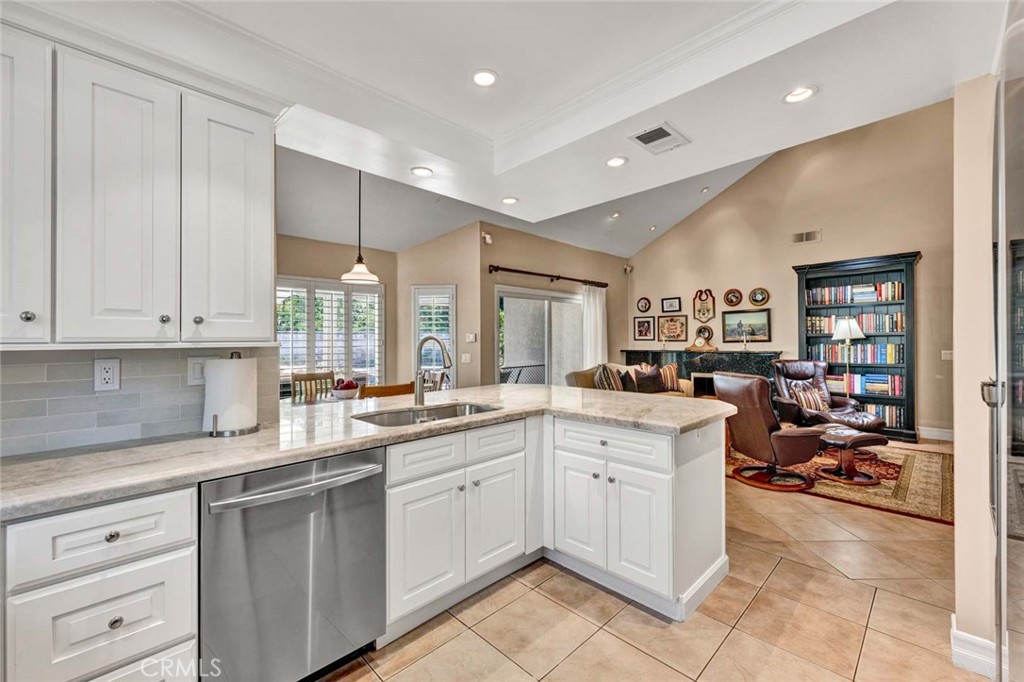 7710 East Strawberry Ridge Orange, CA 92869 - Photo 13 of 33 The kitchen drawers are self-closing and there are pull out shelves in the cabinets and pantry.