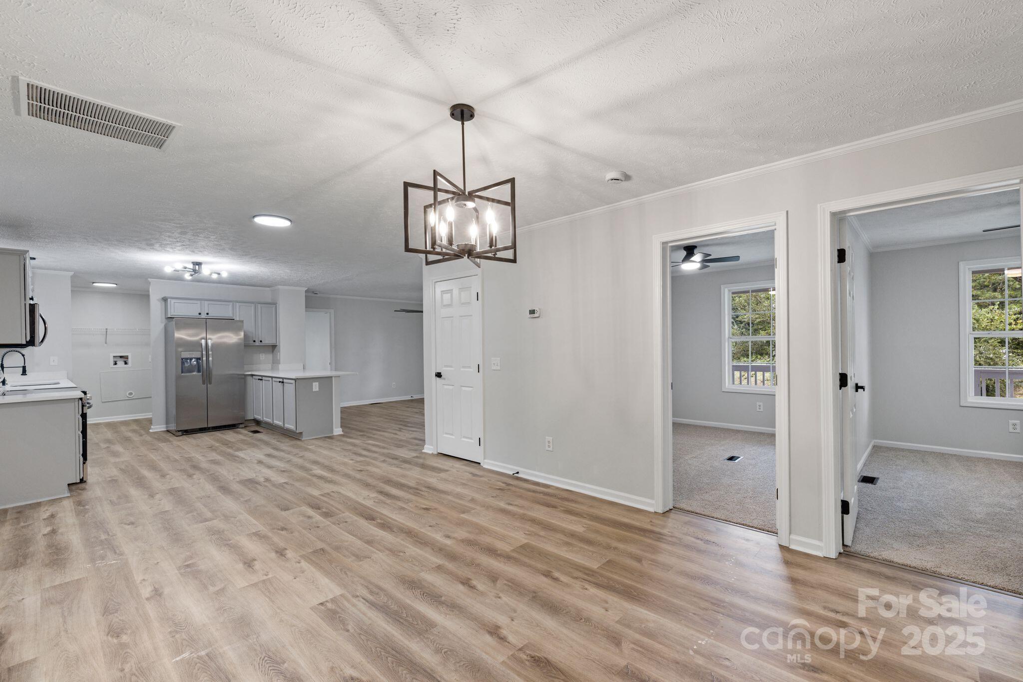 6708 Rebel Road Marshville, NC 28103 - Photo 13 of 41 a view of a livingroom with a furniture wooden floor and a window
