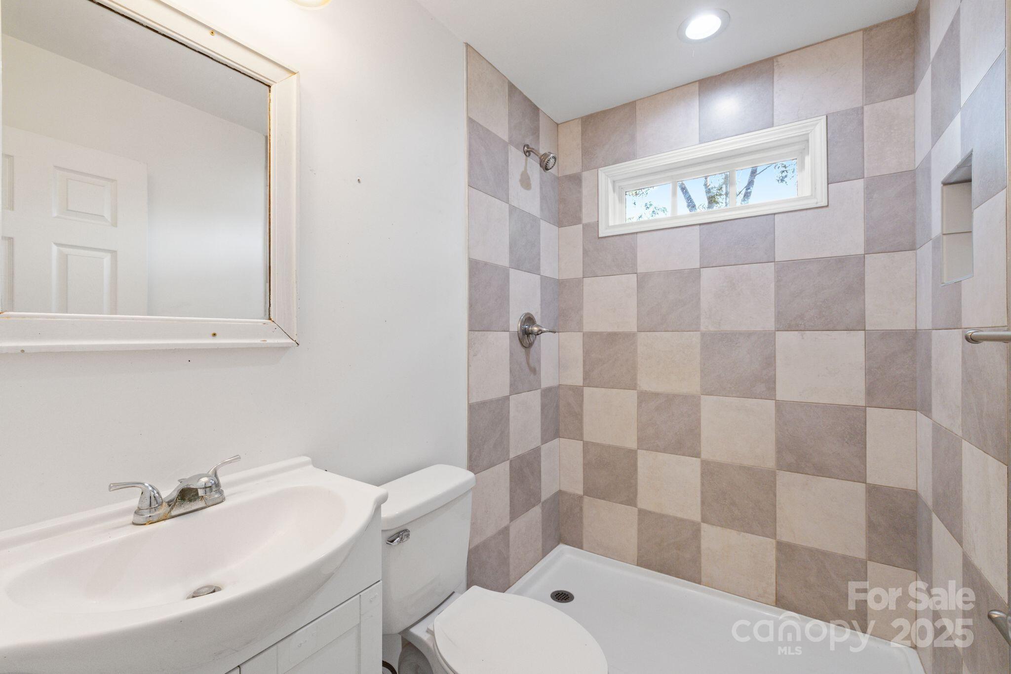 6708 Rebel Road Marshville, NC 28103 - Photo 36 of 41 a bathroom with a sink toilet and shower