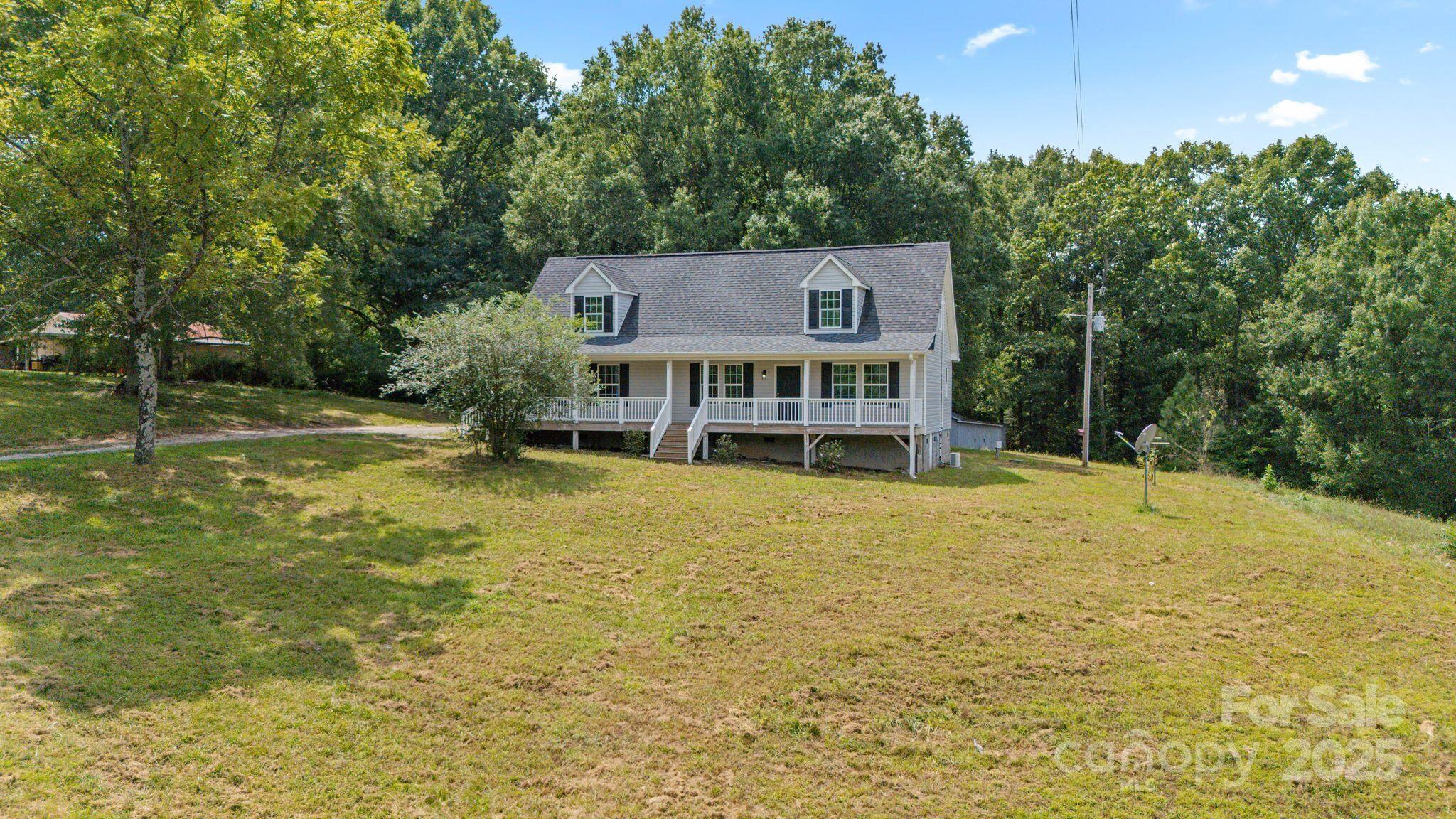 6708 Rebel Road Marshville, NC 28103 - Photo 4 of 41 a view of a house with pool and sitting area