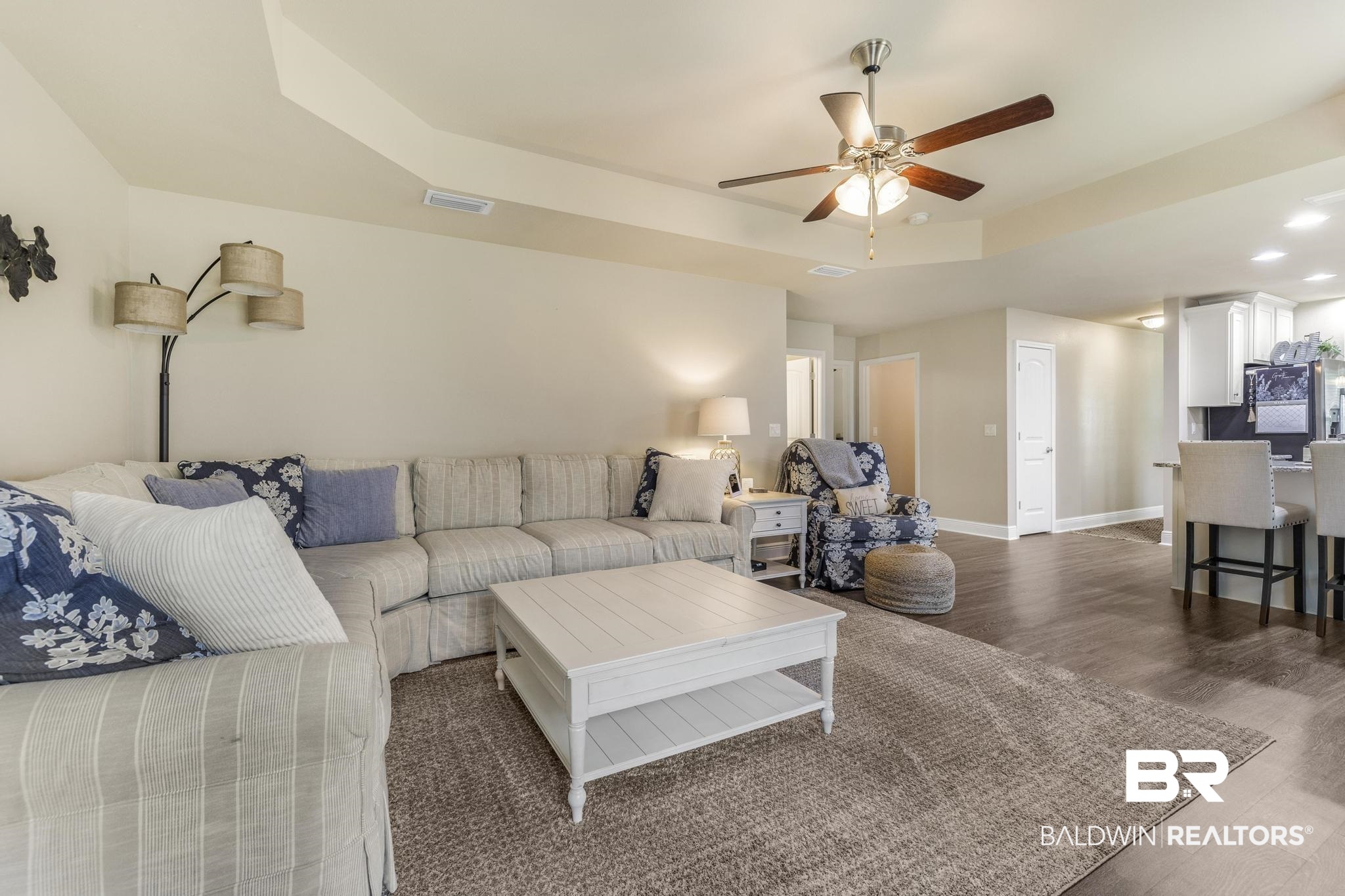 22043 Garland Loop Silverhill, AL 36576 - Photo 16 of 41 Living room with a raised ceiling, dark wood-style floors, a ceiling fan, and recessed lighting