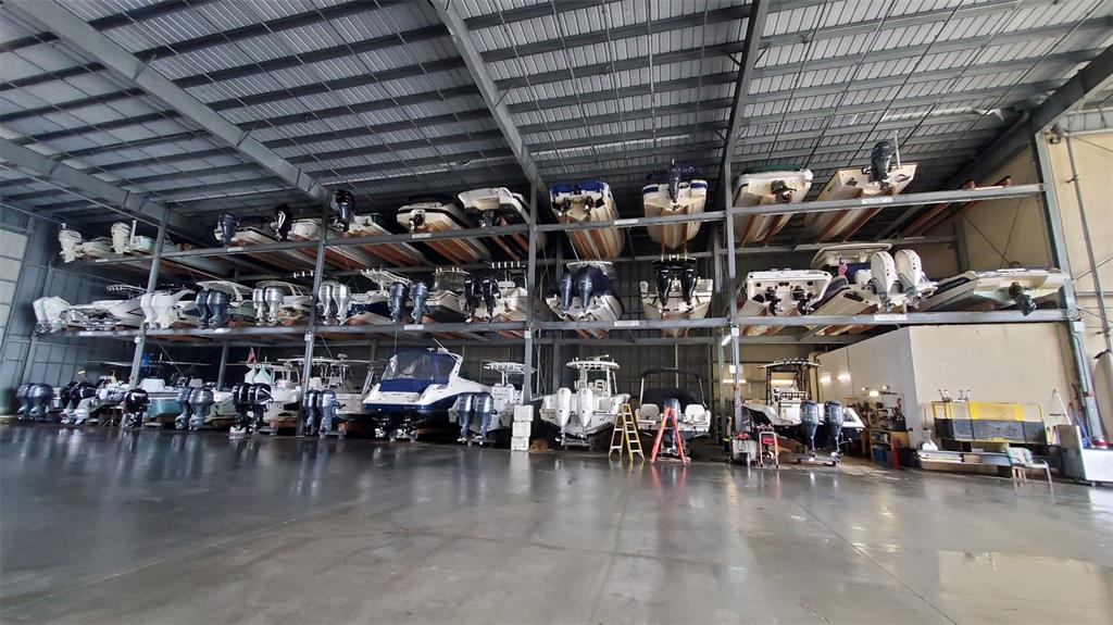 570 Blackburn Point Road, Unit 26 Osprey, FL 34229 - Photo 4 of 4 a view of a storage room with lots of racks