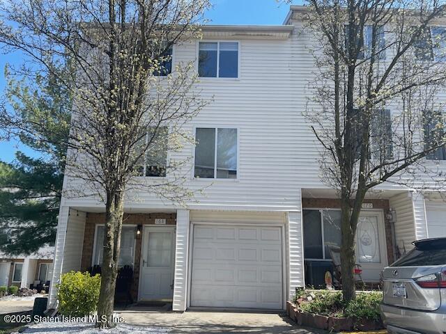 168 Jamie Lane Staten Island, NY 10312 - Photo 1 of 26 a front view of a house with garden