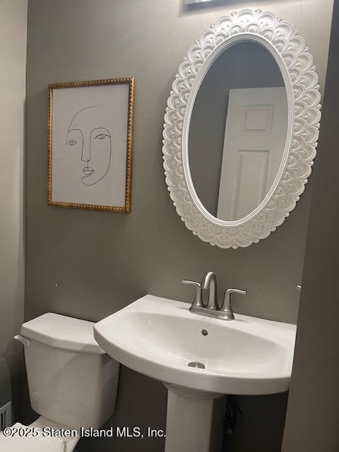 168 Jamie Lane Staten Island, NY 10312 - Photo 13 of 26 a bathroom with a toilet and a sink