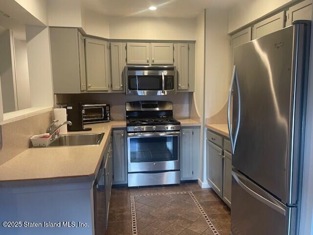 168 Jamie Lane Staten Island, NY 10312 - Photo 2 of 26 a kitchen with kitchen island a counter top space stainless steel appliances and cabinets