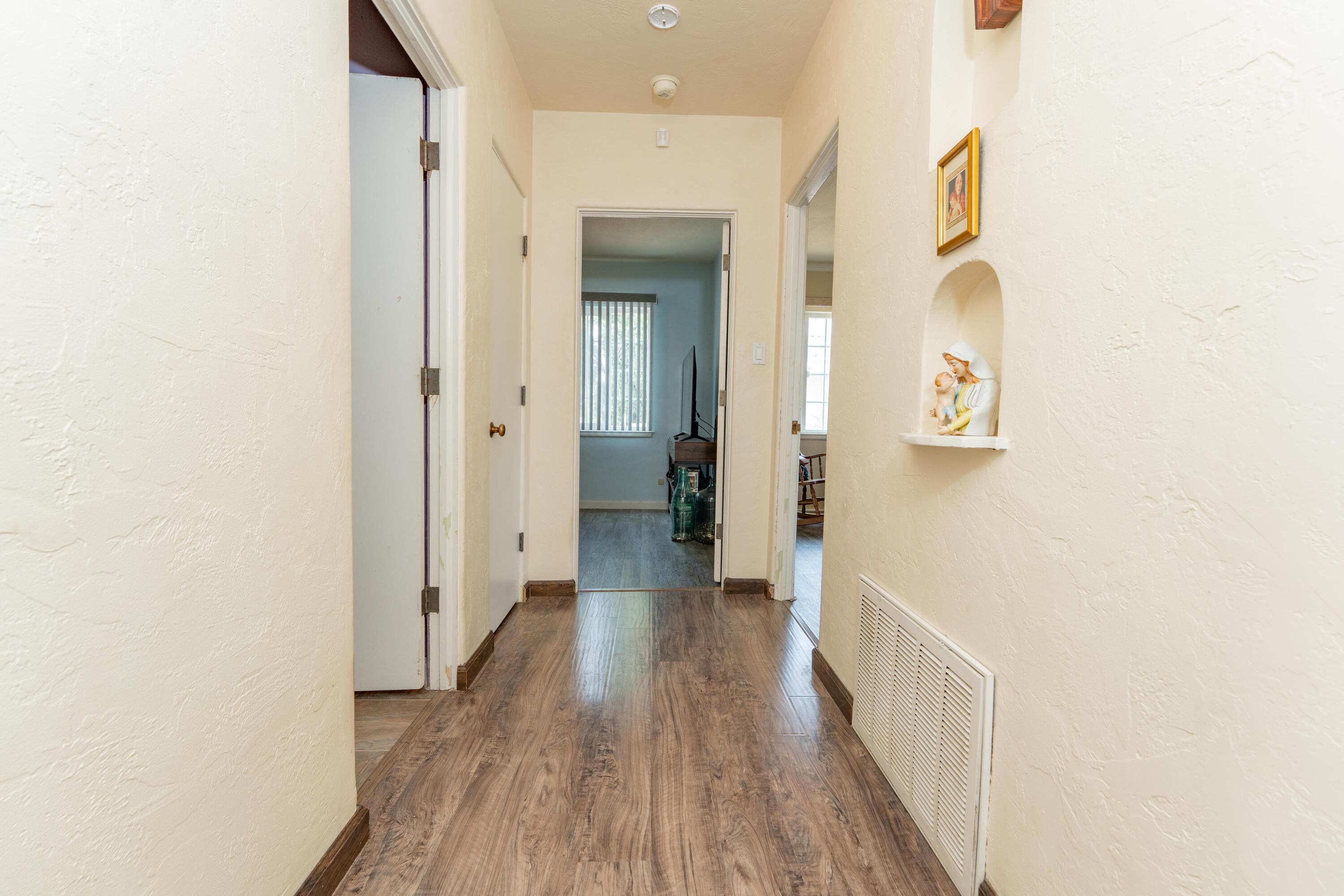 570 North Birch Avenue Reedley, CA 93654 - Photo 27 of 52 a view of a hallway with wooden floor