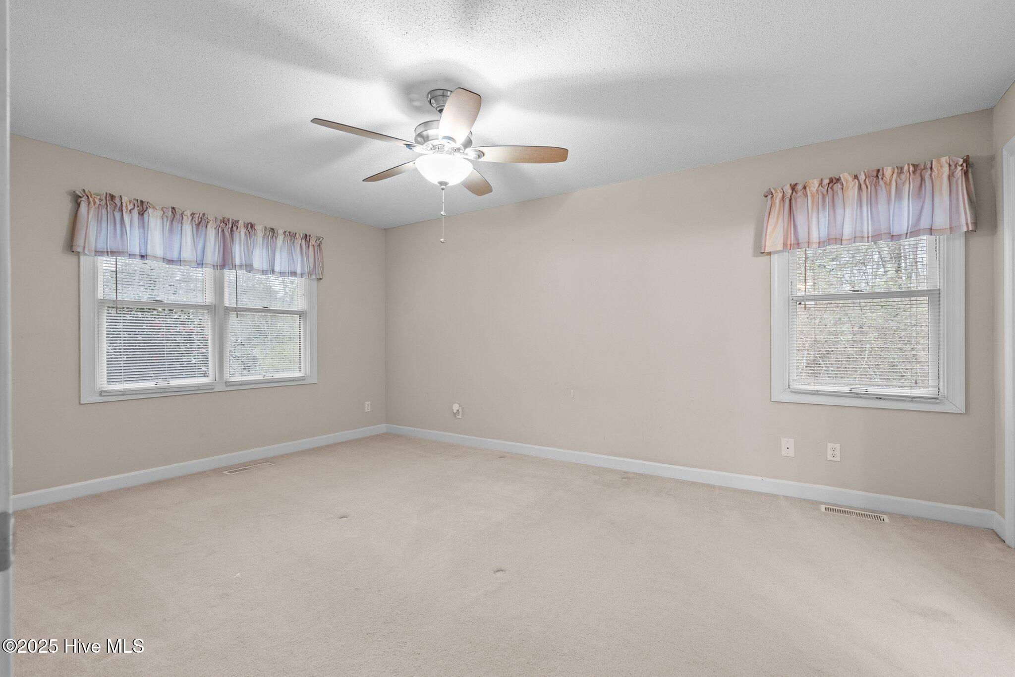 4094 Niagara Carthage Road Whispering Pines, NC 28327 - Photo 31 of 57 Primary Bedroom from hallway.