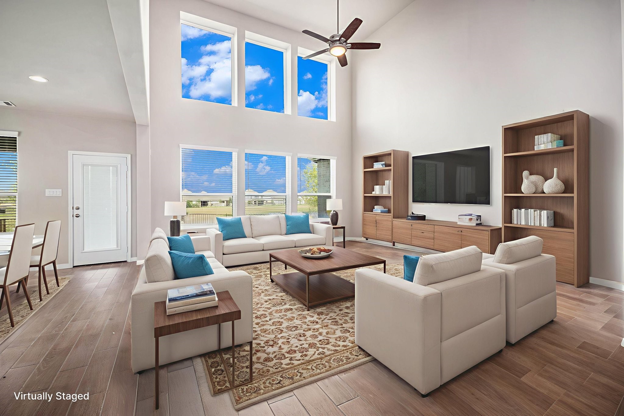 25 Carmel Drive Manvel, TX 77578 - Photo 11 of 50 a living room with furniture wooden floor and a flat screen tv