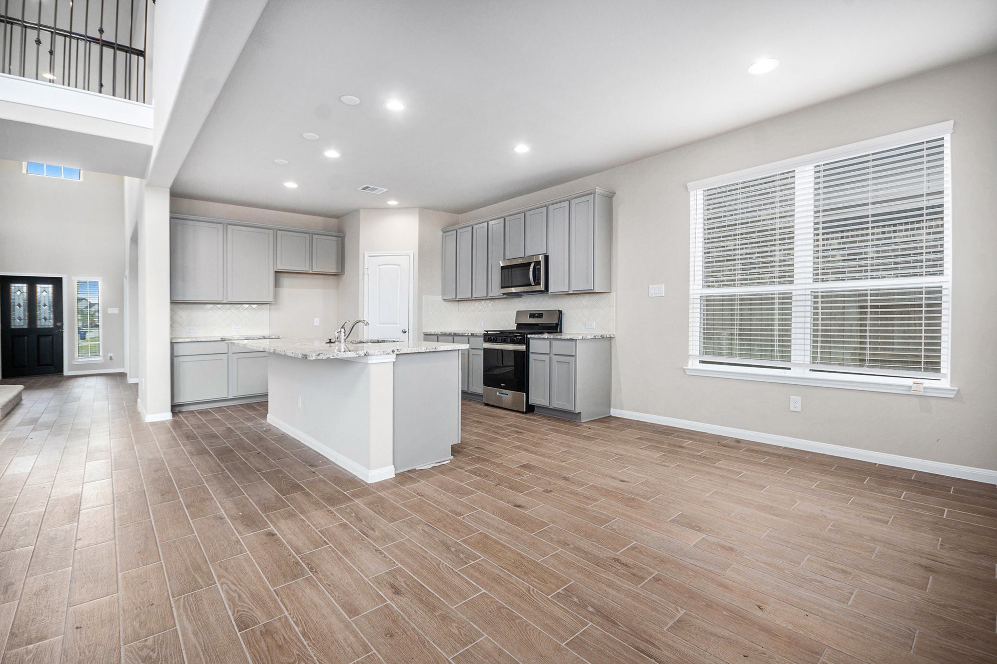 25 Carmel Drive Manvel, TX 77578 - Photo 13 of 50 a kitchen with a refrigerator and a stove top oven