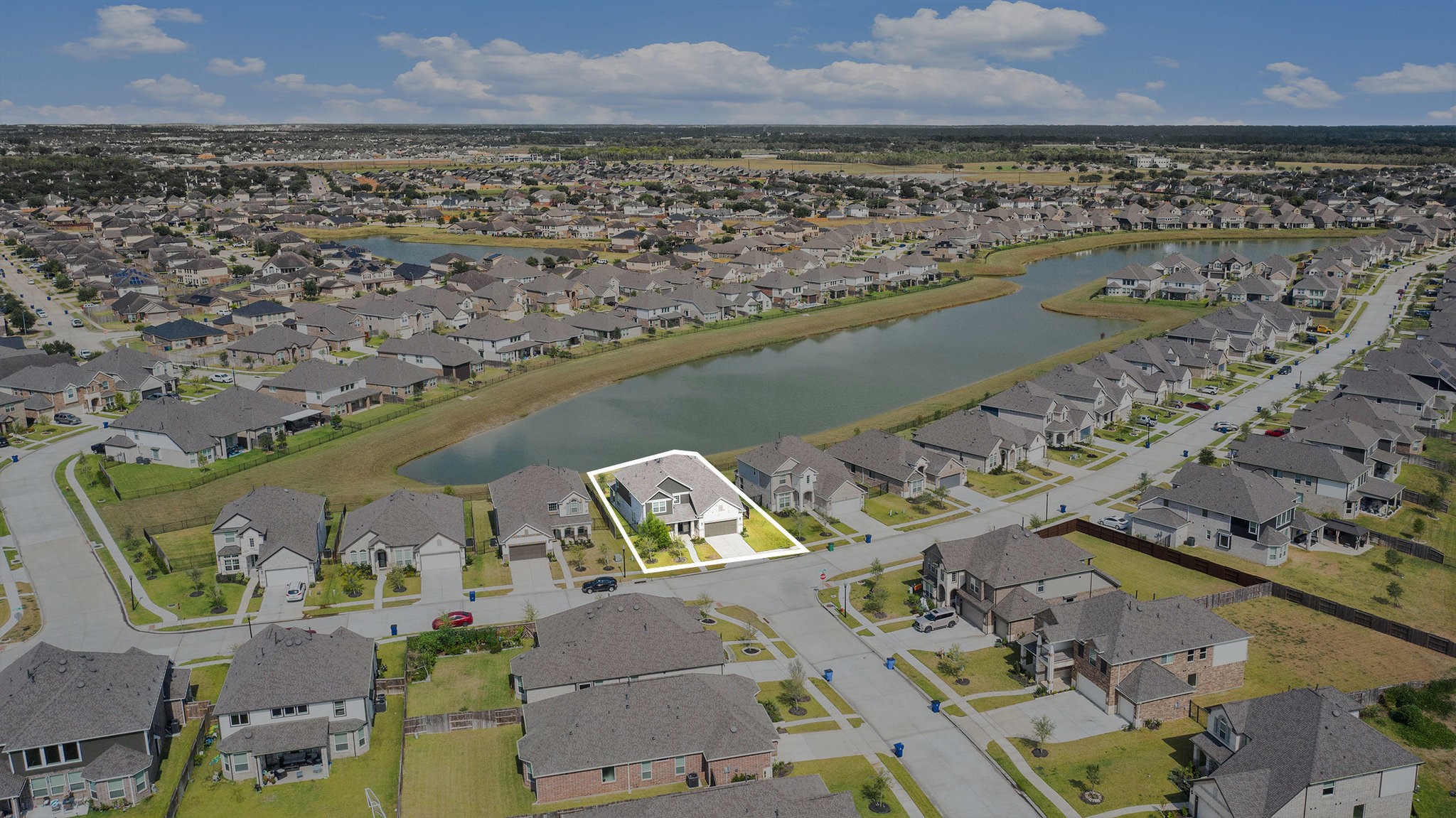 25 Carmel Drive Manvel, TX 77578 - Photo 4 of 50 an aerial view of a house with a lake view