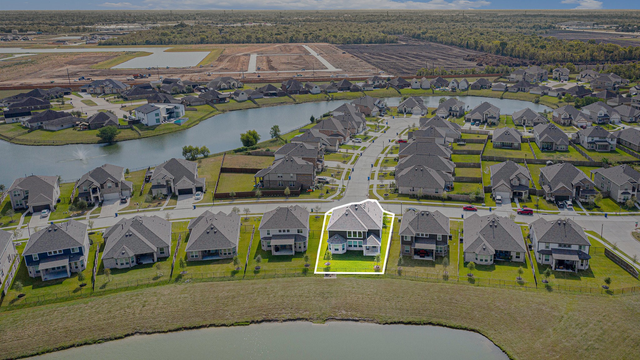 25 Carmel Drive Manvel, TX 77578 - Photo 48 of 50 an aerial view of a house with a lake view