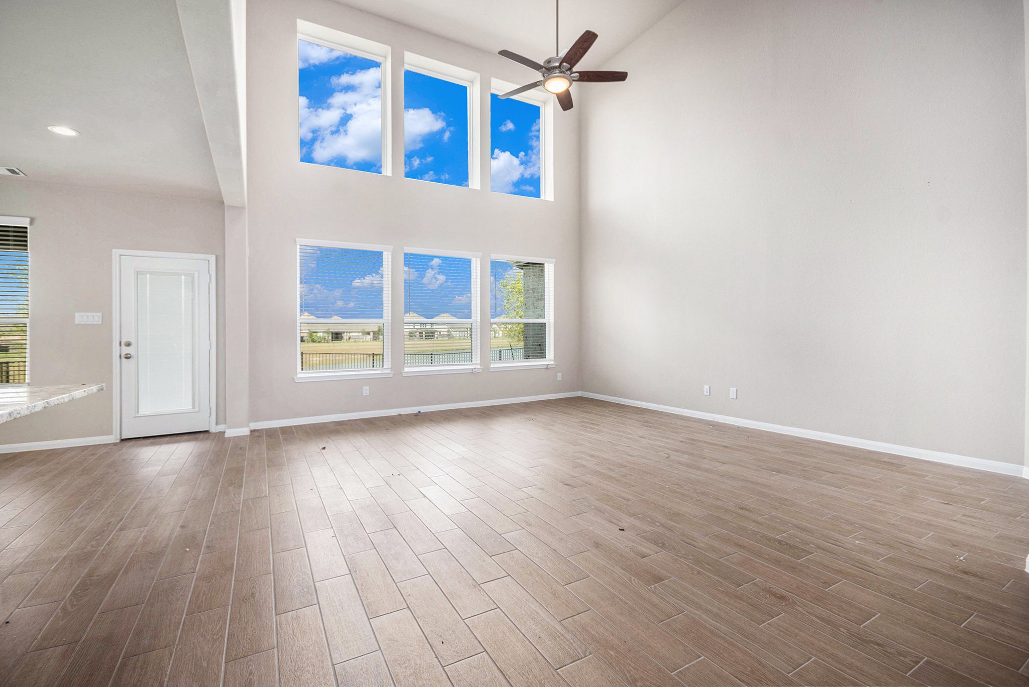 25 Carmel Drive Manvel, TX 77578 - Photo 10 of 50 wooden floor in an empty room with a window