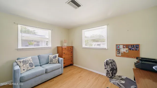 a living room with furniture and a window