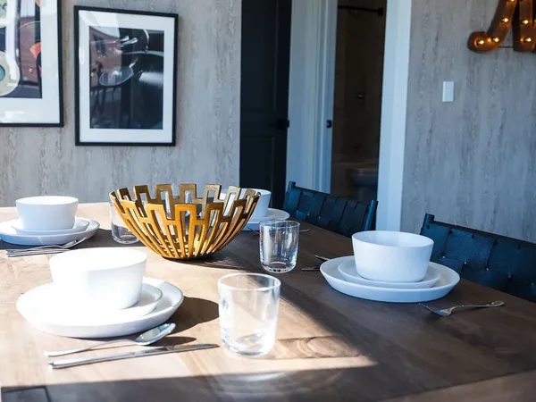 a dining room with table and chairs