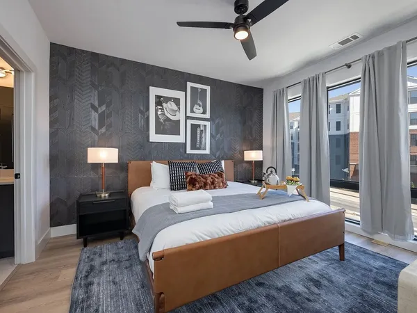 a bedroom with bed and window