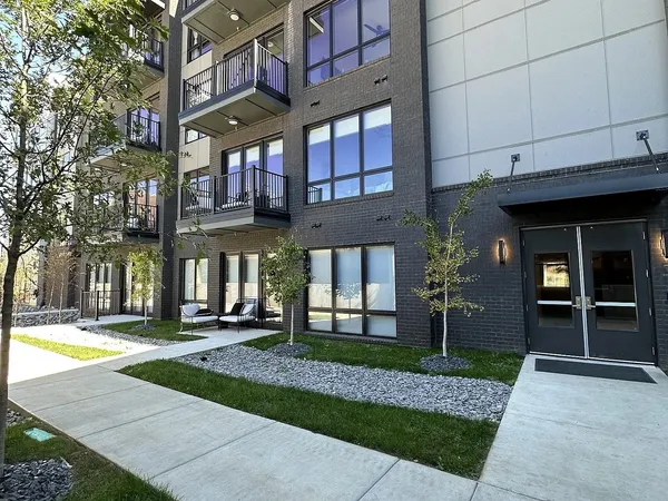 a view of a building with a yard