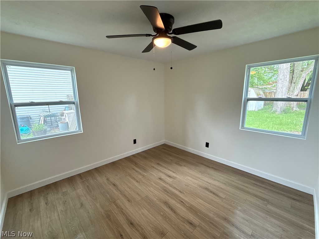 4841 Marigold Road Mentor, OH 44060 - Photo 4 of 12 Neutral-toned interior featuring wood-finish flooring and a ceiling fan