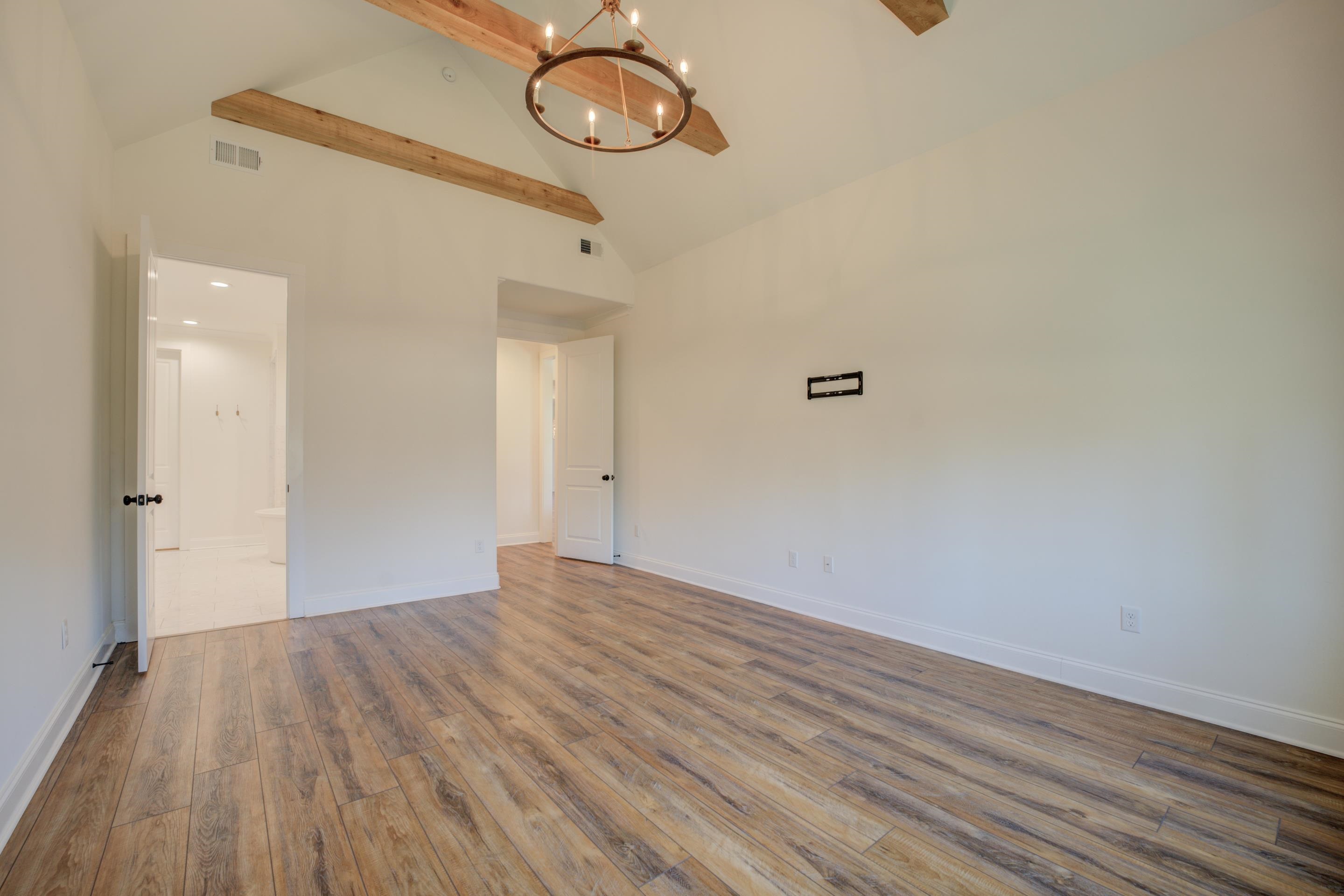 1373 Belfair Drive Collierville, TN 38017 - Photo 16 of 24 a view of a room with wooden floor and white walls