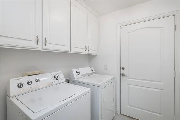 a view of storage and utility room with washer and dryer