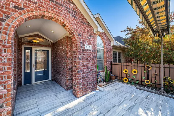 a view of an entryway door with wooden floor